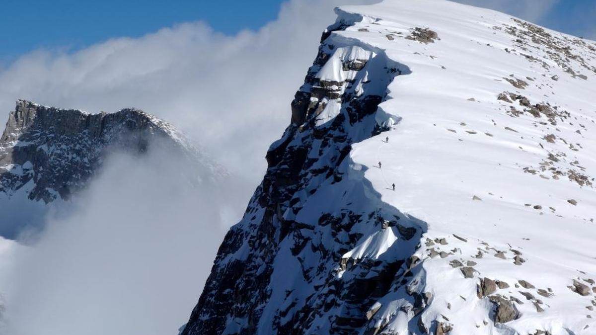 In this March 22 photo, skiers move uphill in Sequoia National Park. The Sierra snow survey last week showed improvement, but made it clear that water conservation measures must continue.