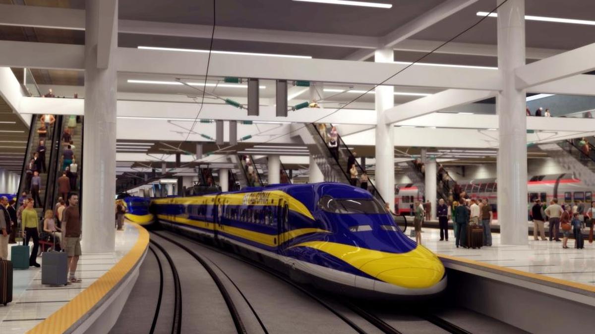 This artist’s rendering shows a high-speed rail train pulling into a station.