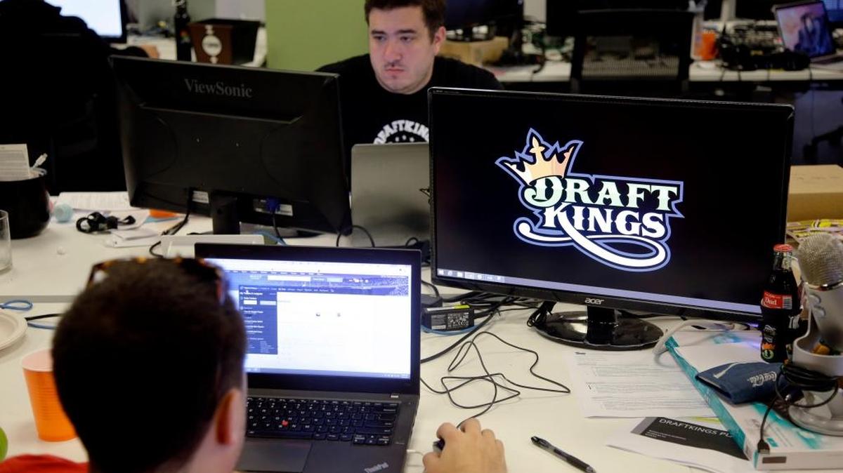 
In this Sept. 9, 2015, photo, Len Don Diego, marketing manager for content at DraftKings, a daily fantasy sports company, works at his station at the company’s offices in Boston. New York’s attorney general sent letters to DraftKings and FanDuel on Oct. 6 demanding that they turn over details of any investigations into their employees.
