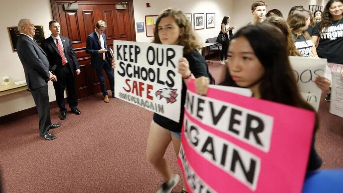 Student survivors from Marjory Stoneman Douglas High School, where moe than a dozen students and faculty were killed in a mass shooting, walk past the house legislative committee rom, to talk to legislators at the state Capitol, regarding gun control legislation, in Tallahassee, Fla.