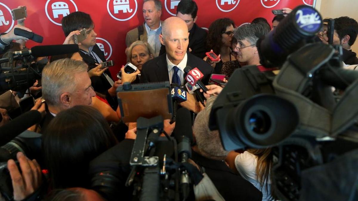 Florida Gov. Rick Scott speaks to the media after a Republican National Committee gathering in Hollywood, Fla., in April. He’s in California this week, trying to persuade businesses to relocate to his state.