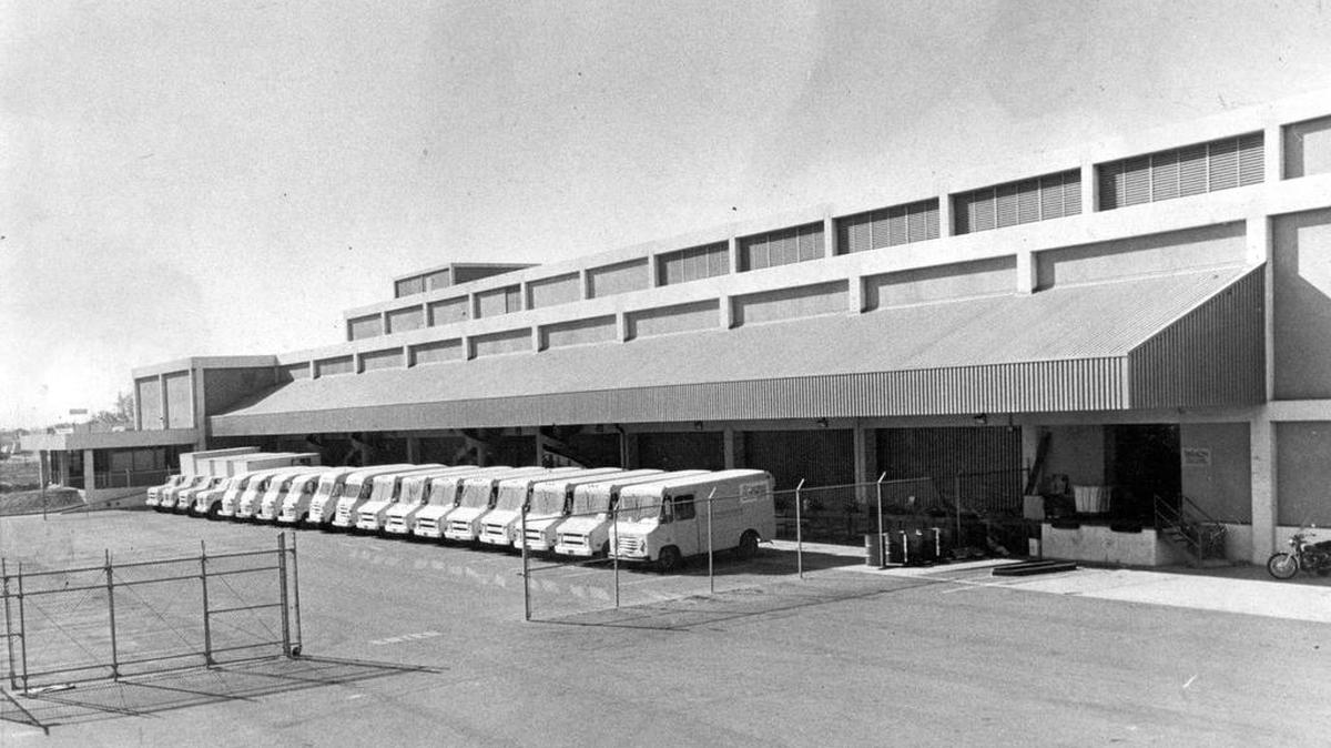 A fleet of trucks ready to deliver newspapers from The Fresno Bee building on E Street in this historic file photo. Today papers are delivered by adult carriers in their personal vehicles.