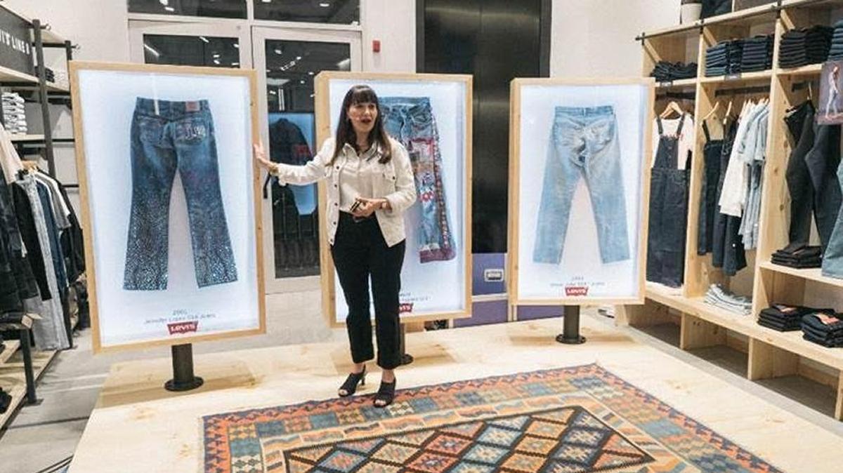 Tracey Panek, historian for Levi Strauss & Co., shows off jeans worn by Steve Jobs, Jennifer Lopez and Doug Hansen, who teaches at Fresno State, in the world’s largest shopping mall in Dubai.