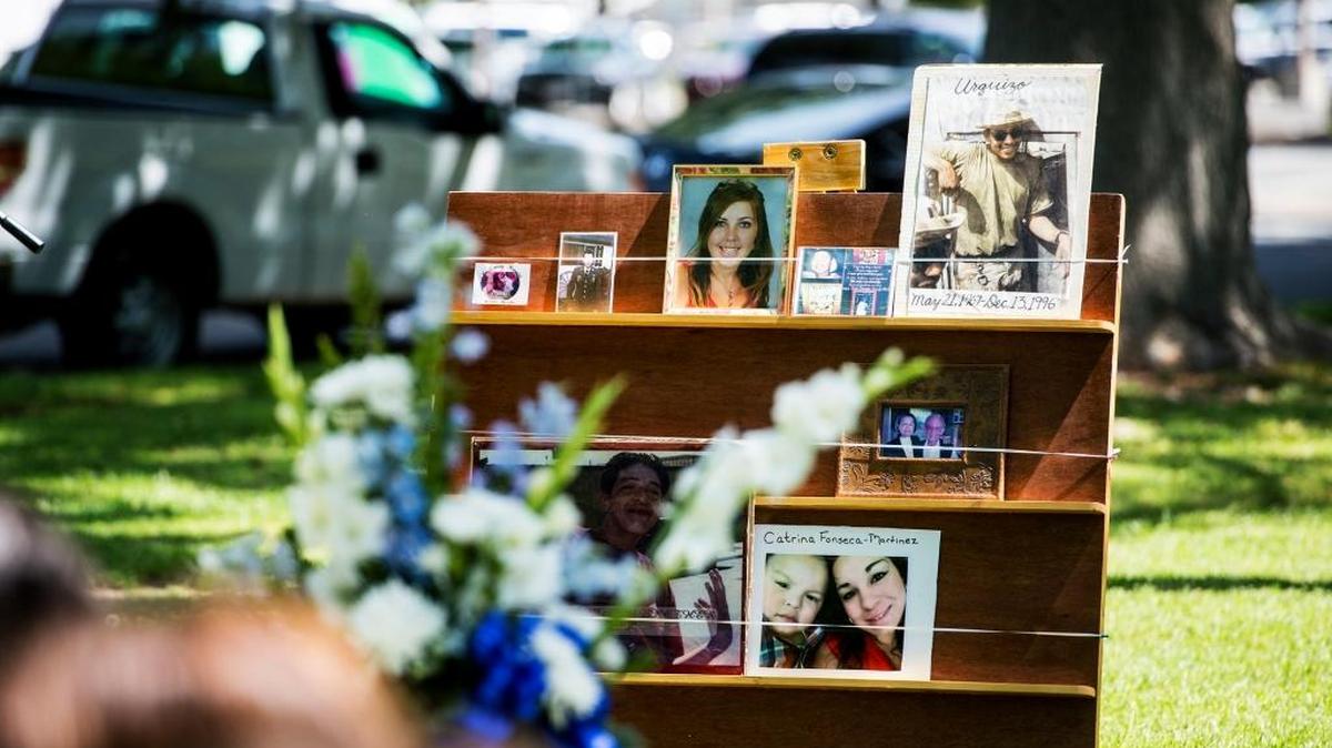 Photographs of murder victims are displayed during a victims’ rights ceremony at Courthouse Park in Merced Calif., Thursday, April 14, 2016.