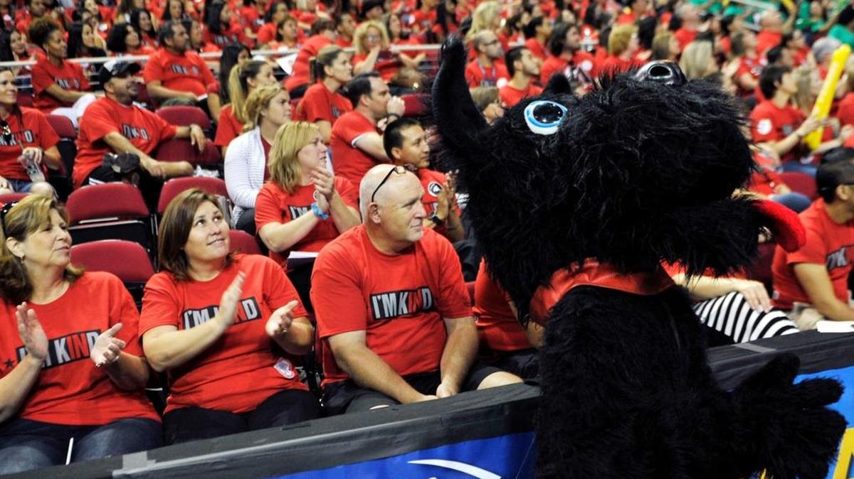 McLane High School’s mascot leads cheers for the school’s group at the start of Fresno Unified School District’s convocation, a spirited gathering of employees held at the Save Mart Center before school started in August.