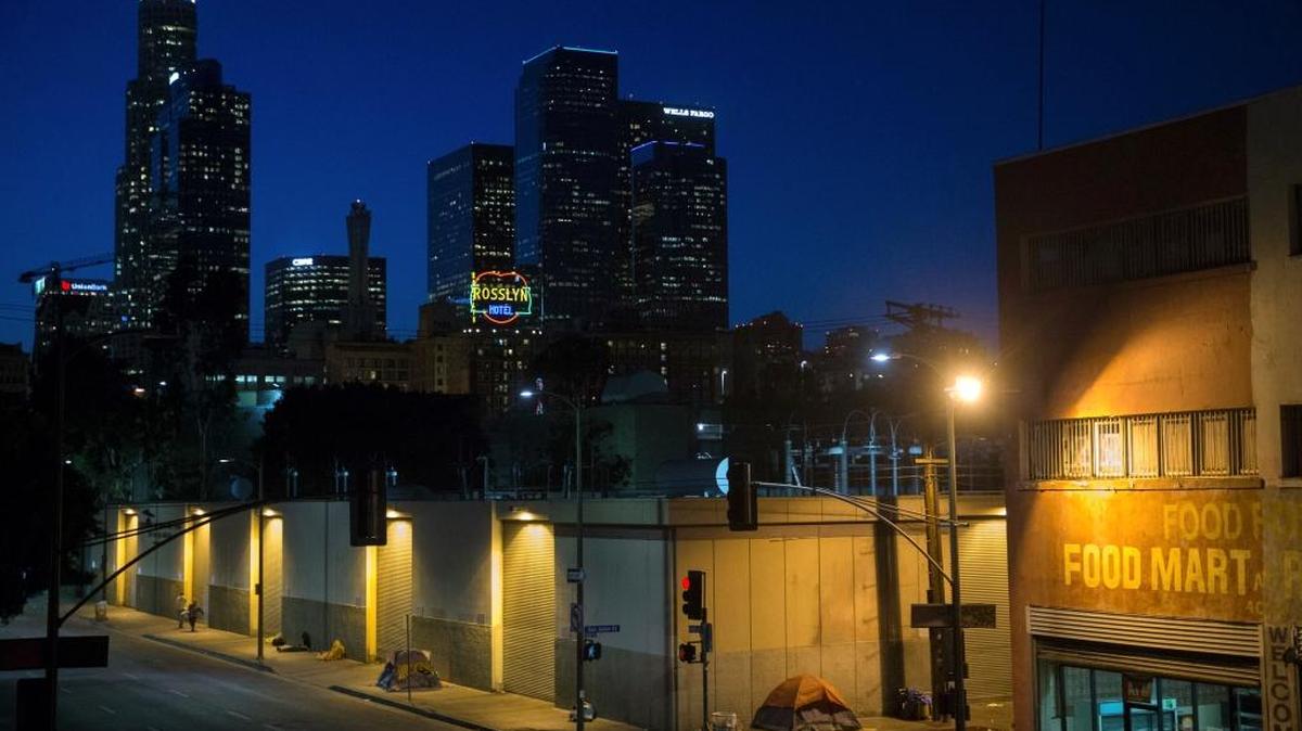 In this April 25, 2016, file photo, homeless people sleep in the Skid Row area of downtown Los Angeles. California policymakers have been too slow to provide felons with necessary care and treatment upon their release in accordance with Proposition 47. The result: increasing numbers of homeless who steal to support their drug habits.