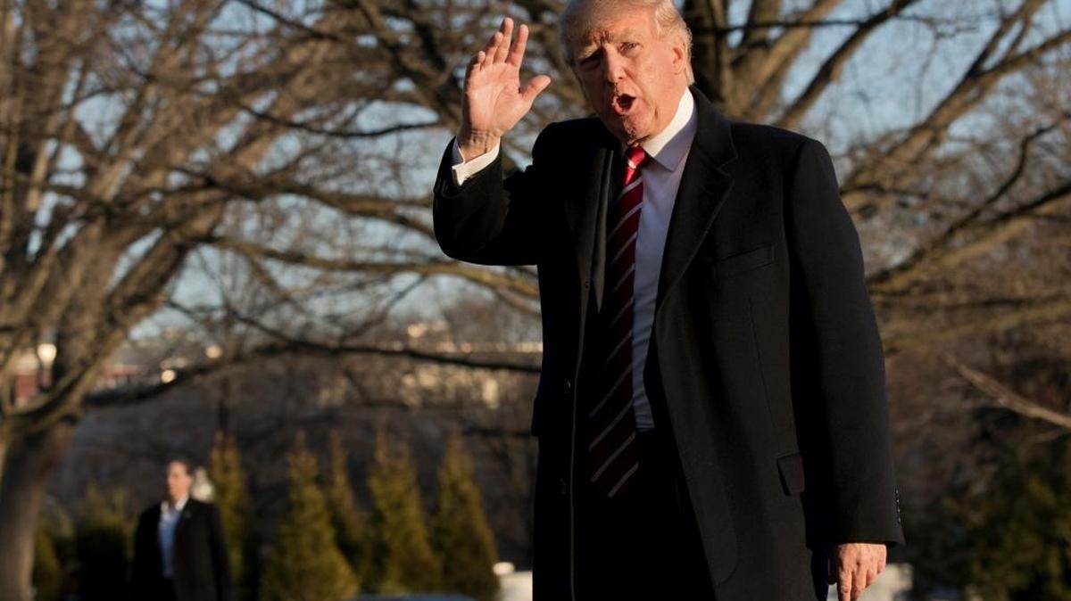 President Donald Trump waves as he walks on the South Lawn upon arrival at the White House on Monday, Feb. 6, 2017 from vacation in Florida.