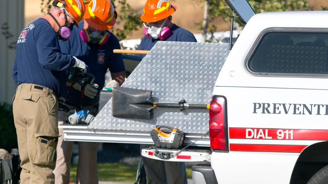 
Investigators from the Pullman Fire Department work outside the Planned Parenthood building in Pullman, Wash., on Sept. 4. Fire investigators say that the early morning fire was arson. 
