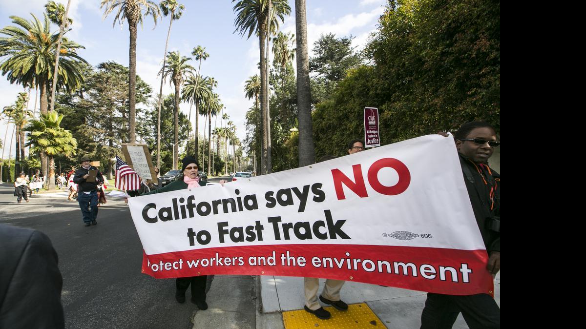 
Los Angeles community members take to the streets May 7 to oppose fast-tracking the Trans-Pacific Partnership trade agreement with Pacific Rim nations.
