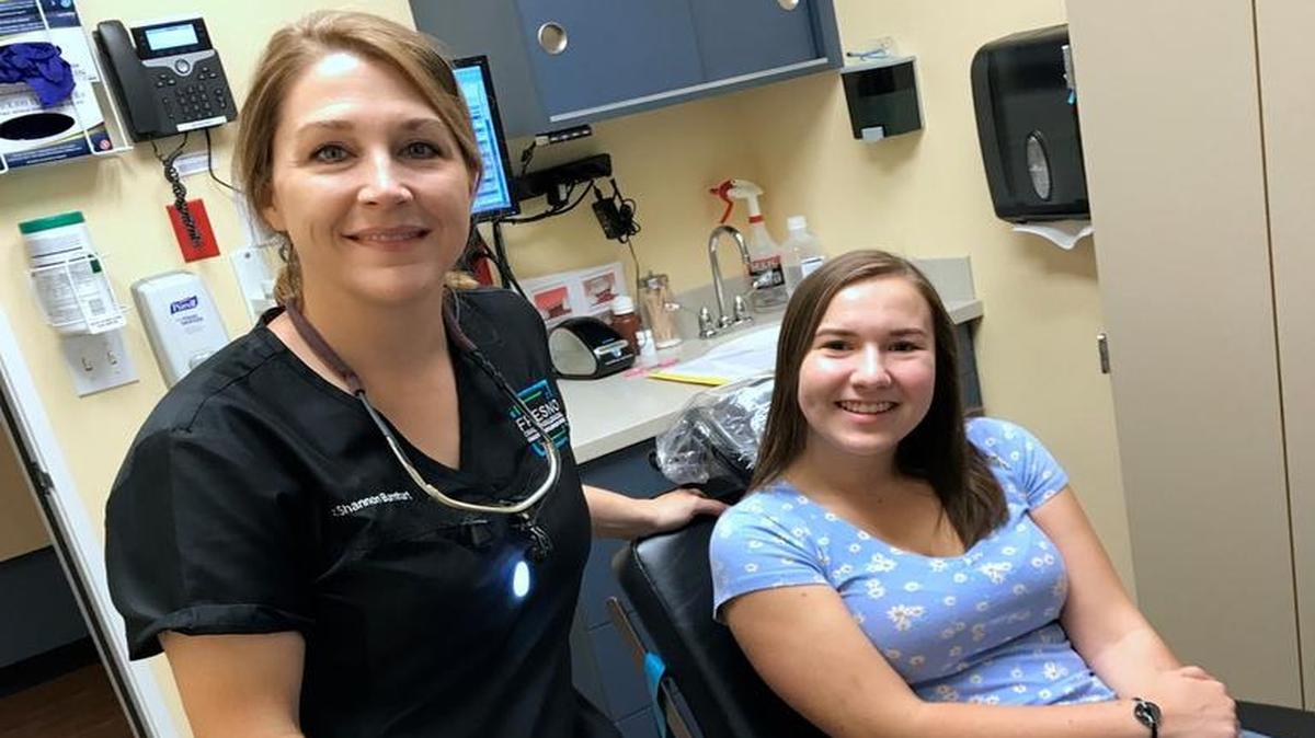 Brianna Pranger of Madera gets her pre-operative examination from Dr. Shannon Barnhart, an oral surgeon, who removed her wisdom teeth on Thursday. Pranger wrote the winning essay in a contest for college students in need of wisdom tooth extraction. It was a favor paid forward for Barnhart, whose own wisdom teeth were removed gratis while she was in college by a generous Texas oral surgeon.