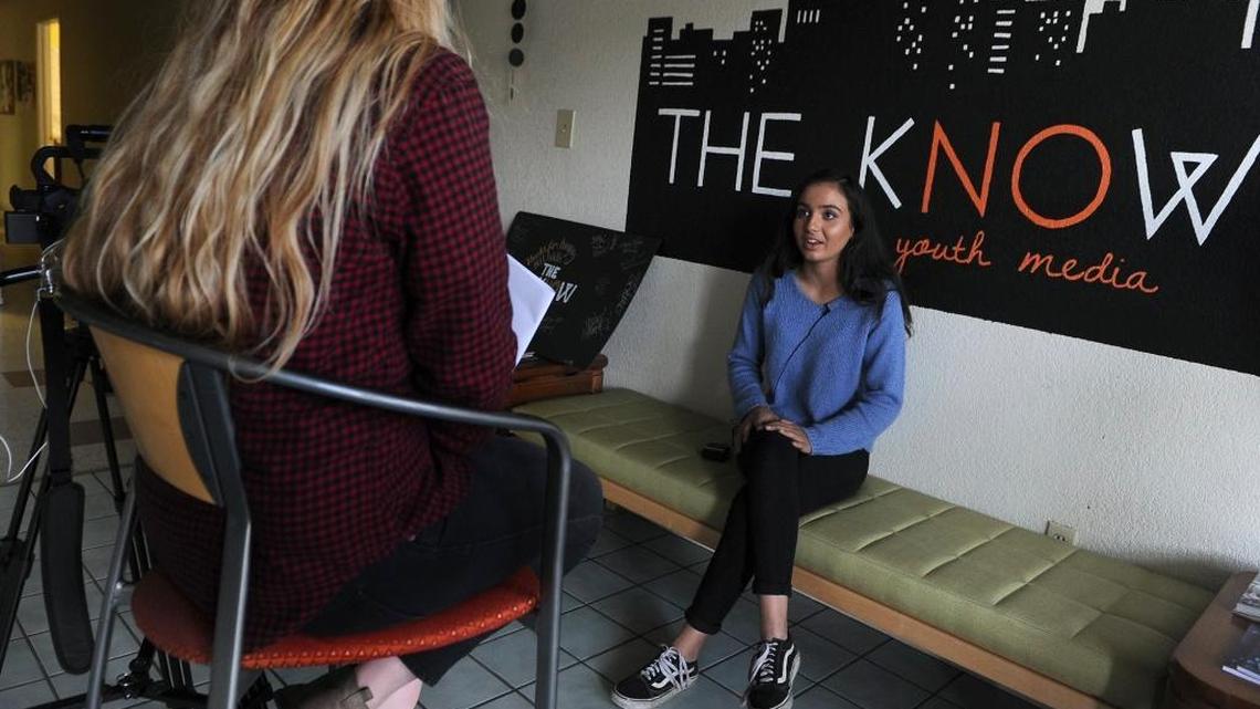 Maya Vannini, 17, right, is interviewed by Fresno Bee reporter MacKenzie Mays, left, at The Know Youth Media Project, Oct. 18 in Fresno.