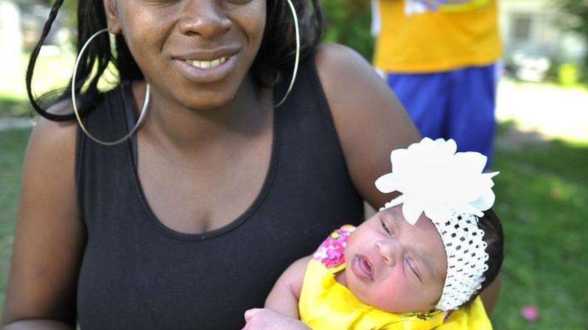 In this 2015 photo, Maktius Hayes holds her then 2-week-old daughter, Serenity Secoy, as husband Steve Secoy holds their 18-month-daughter, Autumn Secoy. Autumn was born at 29 weeks. Hayes credits a Black Infant Health program at Fresno County Department of Public Health for helping her give full-term birth to Serenity, who weighed 7 pounds, 15-ounces.