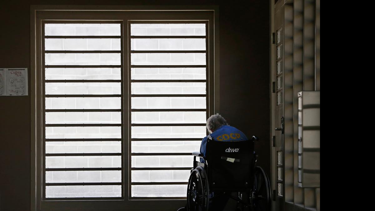 
In this July 24, 2014 photo, an inmate sits by a window at the mental health unit of the California Department of Corrections and Rehabilitation's Stockton Health Facility in Stockton.
