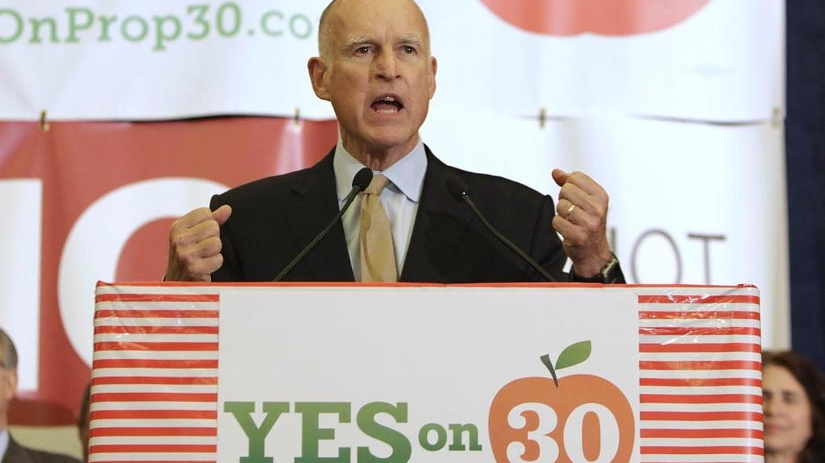 Gov. Jerry Brown thanks supporters for their work on his temporary tax hike initiative, Proposition 30, during an election night party in Sacramento in 2012.