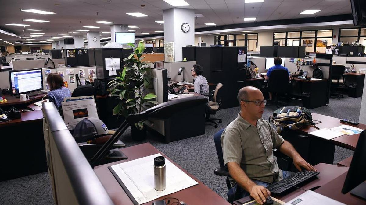 Reporters at work in the Fresno Bee newsroom.