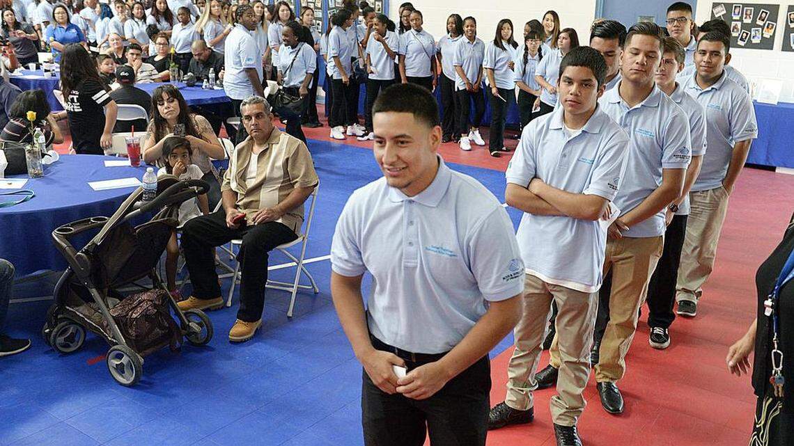 Rodolfo Munoz, 18, of Reedley is the first of 120 teens to accept his diploma after completing the Fresno summer jobs program sponsored by PG&E and the Boys and Girls Clubs of Fresno County, during a ceremony at the Zimmerman Youth Club in Fresno, Friday, August 5, 2016.