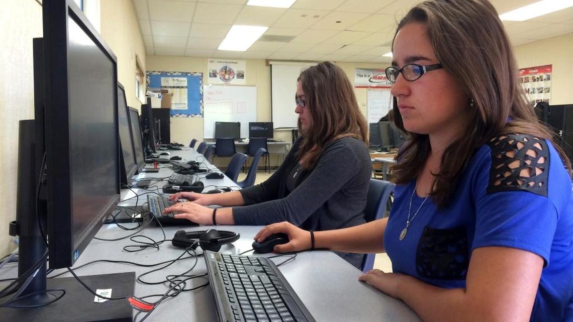 Leticia Fonseca, 16, left, and her sister, Sylvia, work in the computer lab at Cuyama Valley High School in Santa Barbara County after taking the new Common Core-aligned standardized tests. A new system for measuring school performance was approved Thursday in response to Common Core and other school reforms.