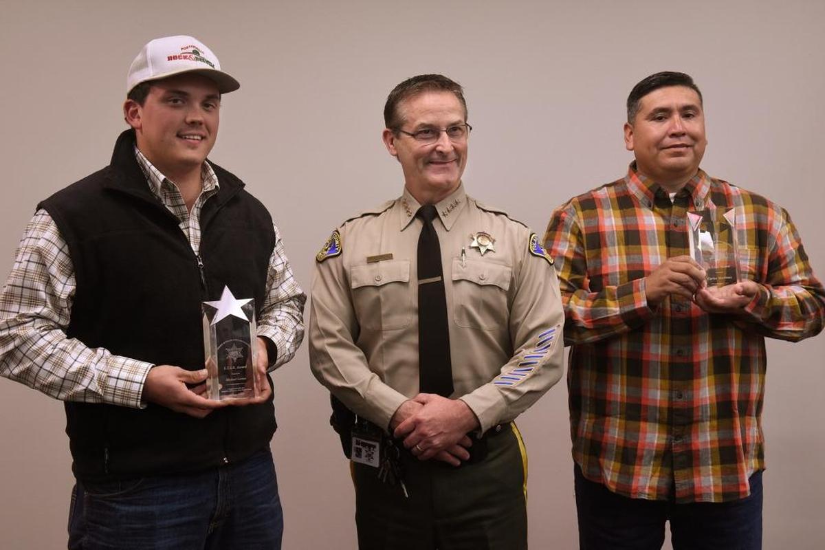 Sheriff Mike Boudreaux presented the STAR Award to Michael Correia, left, and Carlos Martinez during a special ceremony on Nov. 28 at the sheriff’s headquarters. Both men went out of their way to help someone in need.