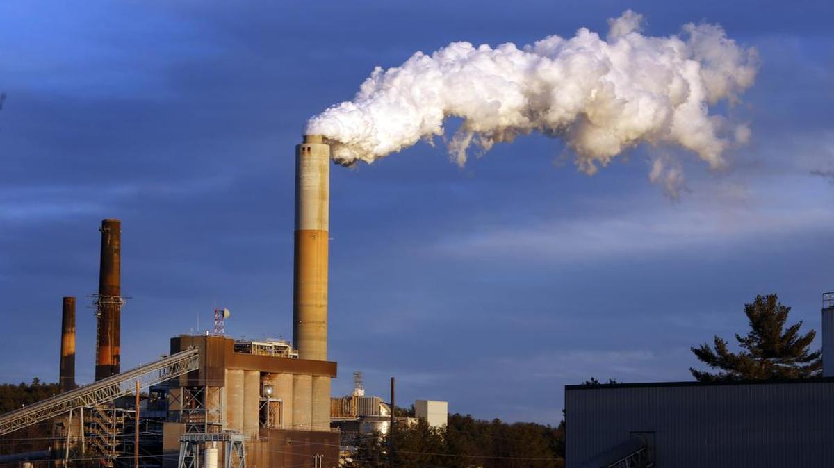 
Steam billows from the coal-fired Merrimack Station in Bow, New Hampshire. President Barack Obama presented his final plan for carbon dioxide reduction targets Aug. 3. The plan would reduce emissions 32% below 2005 levels by 2030. Opponents say they will sue to stop the plan’s implementation.
