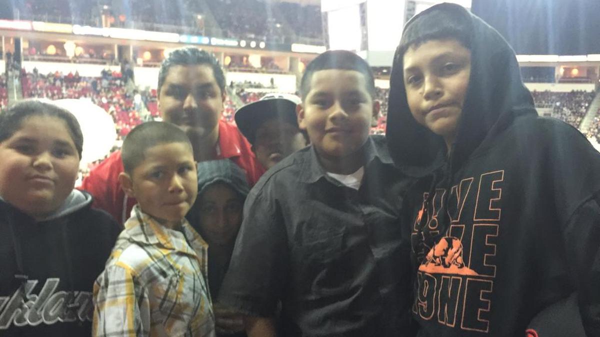Lt. Mark Salazar of the Fresno Police Department enjoys a Fresno State basketball game with Gonzalo Elias, Gustavo Pastlan, Christopher King, Mathew Reyes, Donavan De La Cruz and Orlando Martinez, from left.
