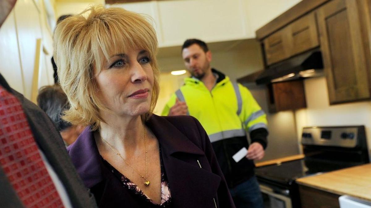 Fresno mayor Ashley Swearengin, left, tours the inside of a tiny house on exhibit outside Fresno City Hall Thursday in downtown Fresno. The exhibit of the 270 square foot structure made by California Tiny House marked the changing of a city ordinance allowing tiny houses to be designated similarly to a backyard cottage. Tiny houses previously fell into the same category as recreational vehicles.