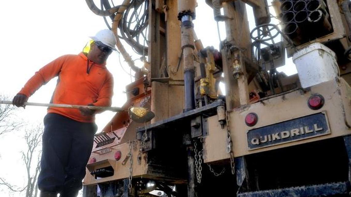 In this March 2015 photo, Frank Rodriguez checks a soil sample with a screen on a pole to see what is coming out of the new water well they’re drilling for Kingsburg resident Abelardo Deleon Garcia. Legislation that would have had local government agencies create a process for issuing permits to drill groundwater wells was pulled in the Legislature’s Water, Parks and Wildlife Committee last week.
