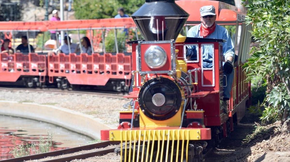 
Train engineer Skip Carlstrom drives the Storyland and Playland train in Roeding Park in Fresno. The children’s parks were the beneficiaries of a recent fundraising party that brought in $11,000. 
