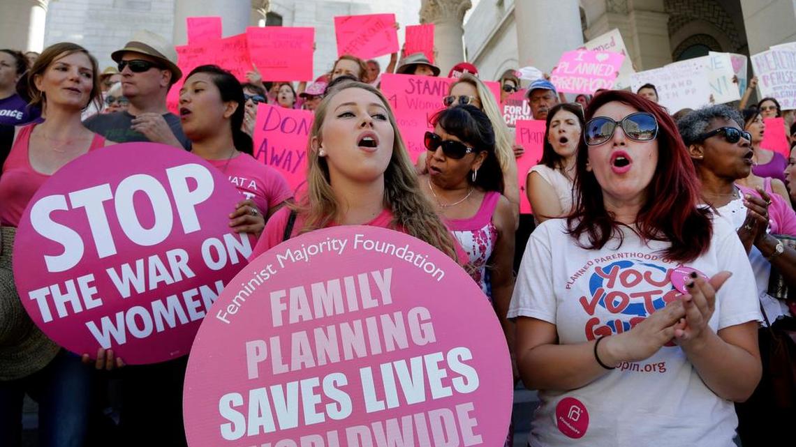 Planned Parenthood supporters in Los Angeles rally in 2015 for women’s access to reproductive health care on National Pink Out Day. Republicans in Congress this week announced plans to strip the group of federal funding.