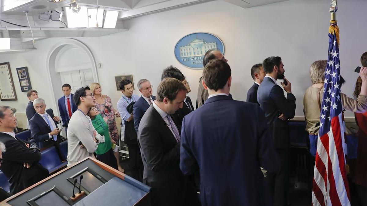 Reporters line up to attend a briefing in Press Secretary Sean Spicer’s office at the White House on Friday. Several reporters were barred, provoking a protest from media organizations.