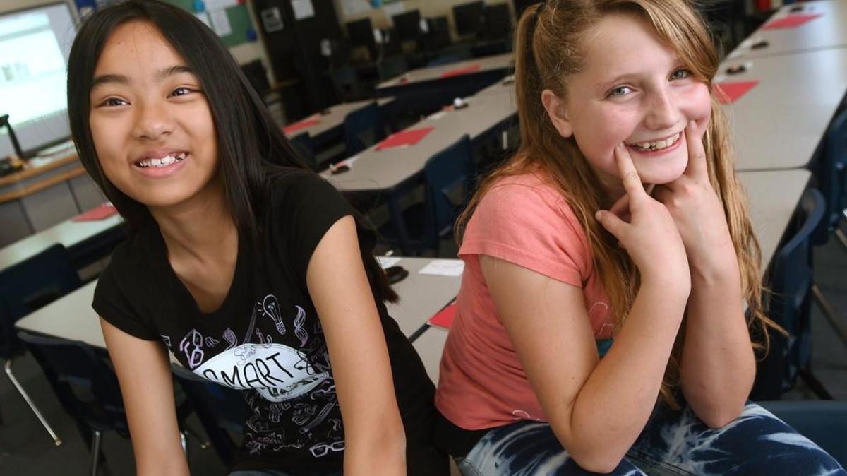 Kalia Lee, 11, left, and Kaylynn Jones, 11, are Temperance-Kutner Elementary students being recognized nationally for reading accomplishments despite adversity.