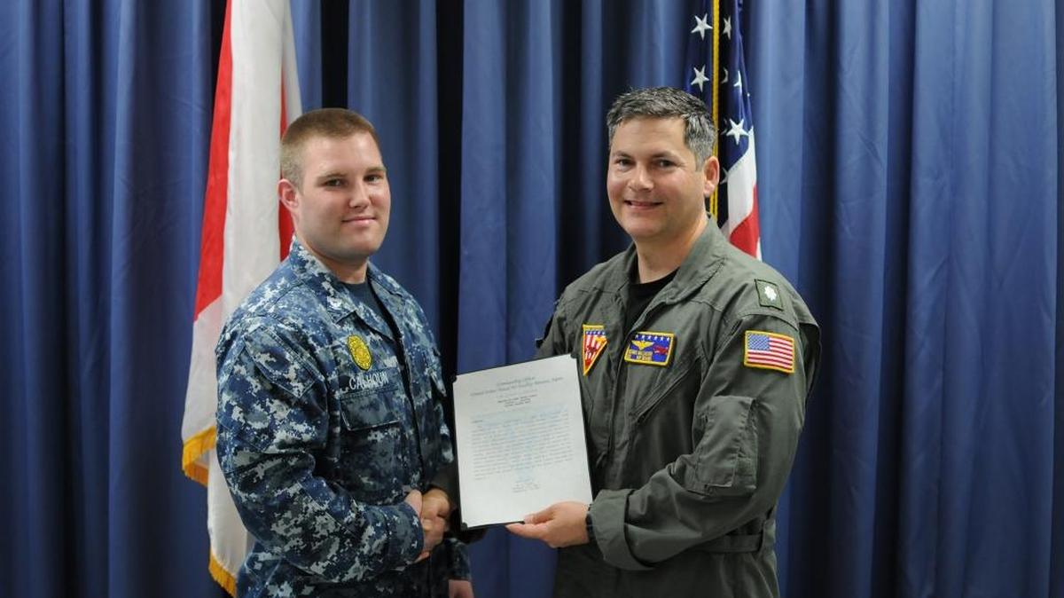 Thumbs up to Navy Master-at-Arms Third Class Justin Calhoun of Clovis, left, for receiving honors from Cmdr. Dennis Malzacher, executive officer of Naval Air Facility Misawa, Japan. Calhoun was given a Letter of Commendation from Capt. Keith Henry, NAF Misawa’s commanding officer, in recognition of his outstanding performance while stationed there.