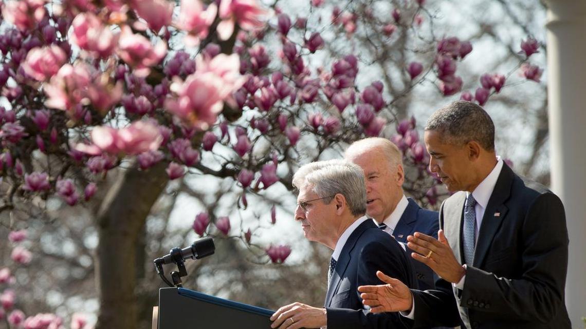 Federal appeals court Judge Merrick Garland, left, accompanied by President Barack Obama and Vice President Joe Biden, steps to the microphone Wednesday in the Rose Garden as he is introduced as Obama’s Supreme Court nominee.
