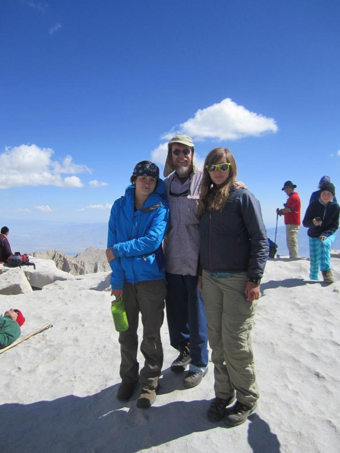 Clovis Unified teacher Michael Murphy atop Mount Whitney in 2012 with students Alex Hough, left and Teagan Pope, right.