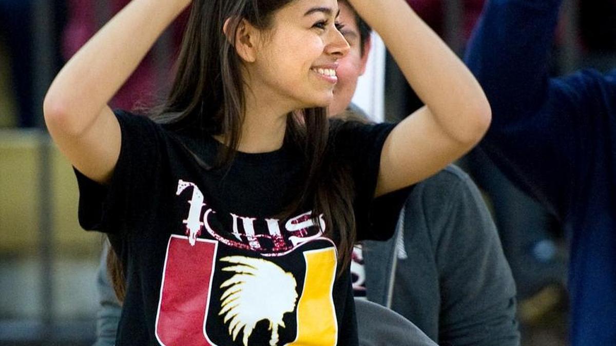 Tulare Union High School’s Ashley Alcantar wears a mascot T-shirt and makes a “U” sign after scoring the correct answer in a quiz in Porterville in February. Four California schools will be forced to change mascots after Gov. Jerry Brown signed legislation barring public schools from using “Redskins” for sports teams.