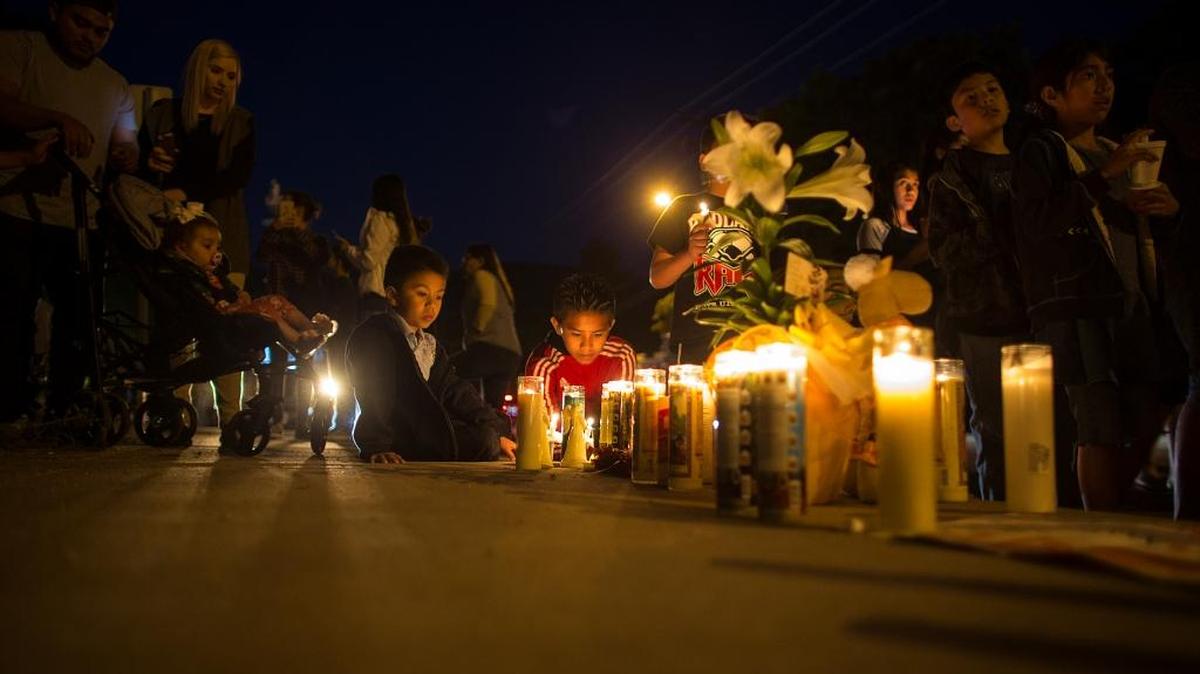 Students grieve at a memorial near North Park Elementary School in San Bernardino.