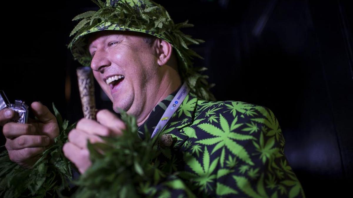 A man who wished to be identified only as “Big Mike” celebrates at an election party hosted by the Berkeley Patients Group for Proposition 64, which legalized recreational pot.