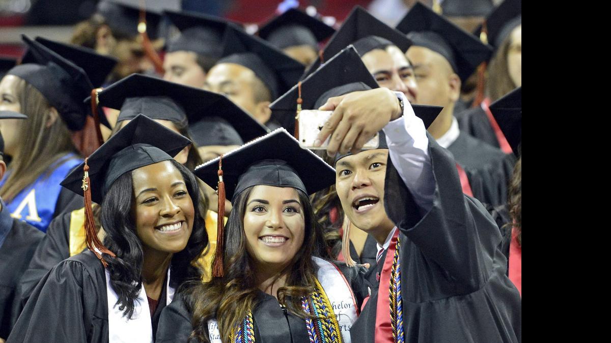 
Fresno State graduating students take a selfie photo in the Save Mart Center before the start of commencement May 16. Proper funding for higher education is a goal of the Legislature’s new Valley Caucus.

