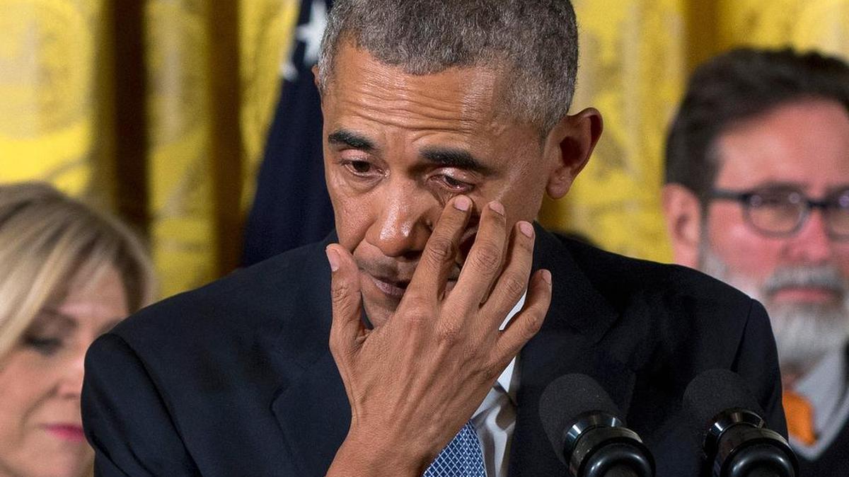President Barack Obama wipes away tears as he speaks Tuesday at the White House about victims of mass shootings. He announced a series of executive actions to reduce gun violence.