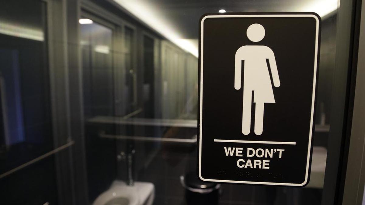 A sign outside of a restroom at the 21c Museum Hotel in Durham, N.C. , is in a legal battle with the federal government over a state law that requires transgender people to use the public restroom matching the sex on their birth certificate.