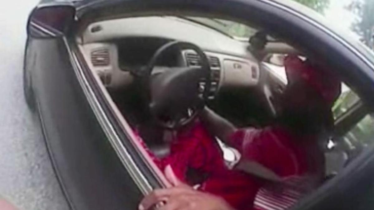 
In this July 19 photo from a body-camera video, then-University of Cincinnati officer Ray Tensing stands next to motorist Samuel DuBose during a traffic stop for a missing front license plate. DuBose was fatally shot by the officer after he refused to get out of the car. 
