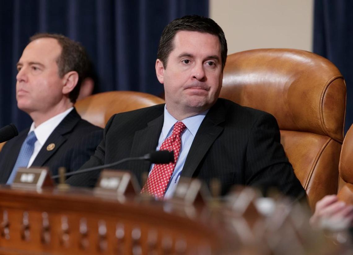 In this photo taken Monday, March 20, 2017, House Intelligence Committee Chairman Devin Nunes, Republican of California, and Rep. Adam Schiff, D-Calif., left, listen to testimony by FBI Director James Comey as the panel holds its first public hearing on allegations of Russian interference in the 2016 U.S. presidential election and the murky web of contacts between President Donald Trump's campaign and Russia.