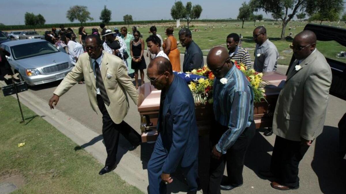 Family and friends carry Henry ‘Hank’ Taylor to his final resting place at Fresno Memorial Gardens Cemetery on Aug. 3, 2006 in Fresno. Taylor was one of 26 Fresno County residents who perished in the horrific 2006 heat wave.