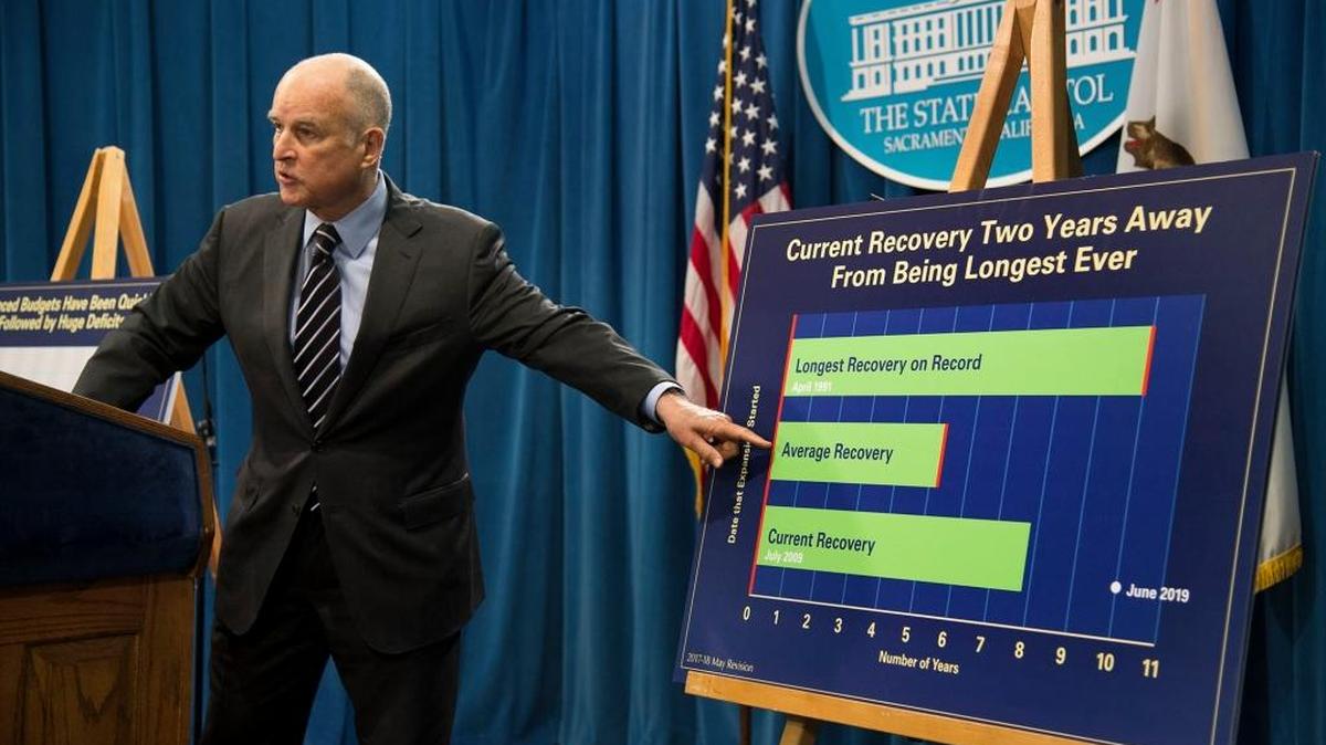 Gov. Jerry Brown refers to a chart regarding his revised budget plan, noting that an economic downturn is coming, during a news conference at the Capitol on Thursday, May 11, 2017, in Sacramento.
