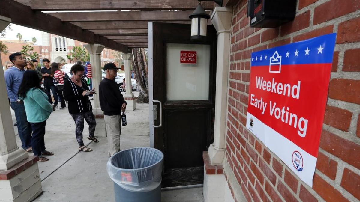 Voters wait to enter a weekend early voting polling place at the North Hollywood branch library in Los Angeles Sunday, Oct. 30, 2016. Unlike in many other states, Californians votes for candidates in congressional and legislative districts that have been drawn by an independent commission – not politicians already in power.