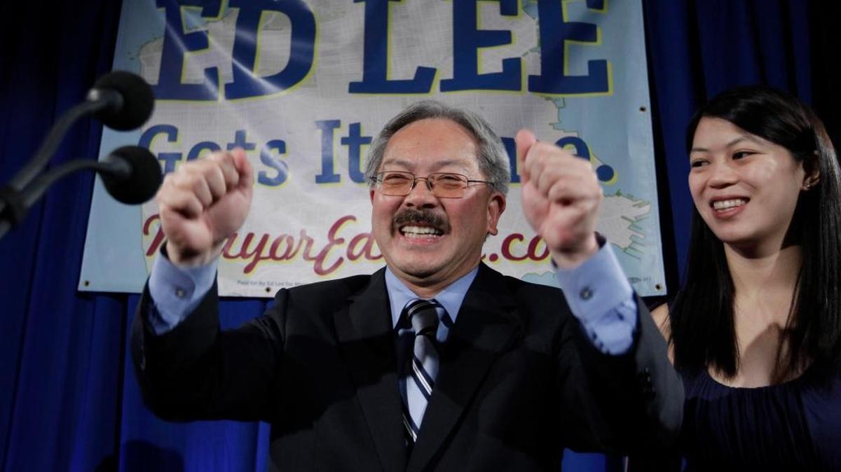 In this Nov. 8, 2011, file photo, San Francisco interim mayor Ed Lee smiles as his daughter, Brianna, looks on at his campaign headquarters in San Francisco. Lee died early Tuesday at age 65.
