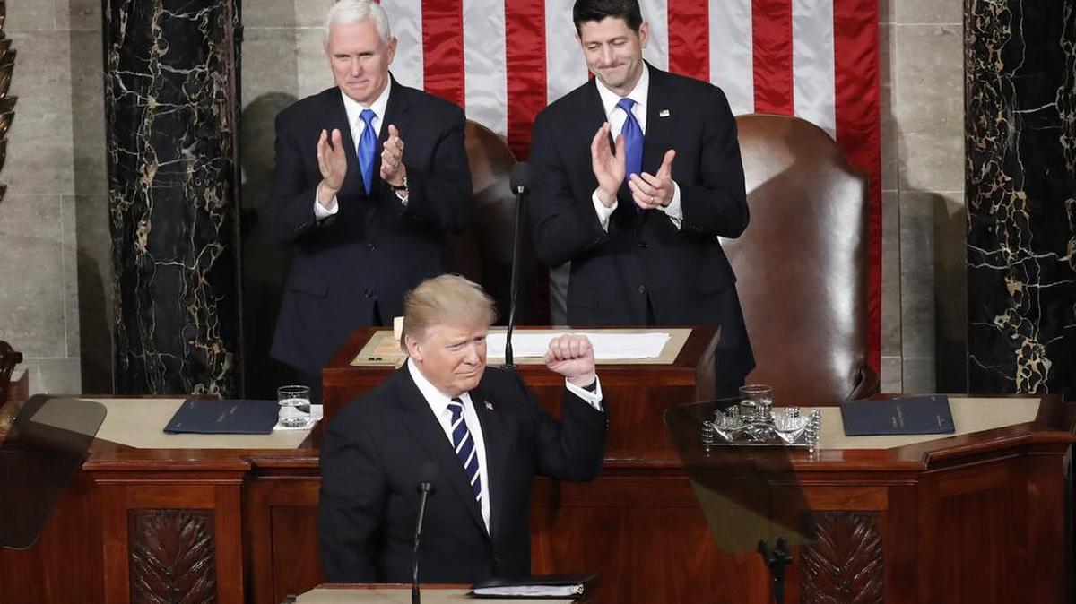 President Donald Trump pumps his fist before starting his first address to Congress on Tuesday night.