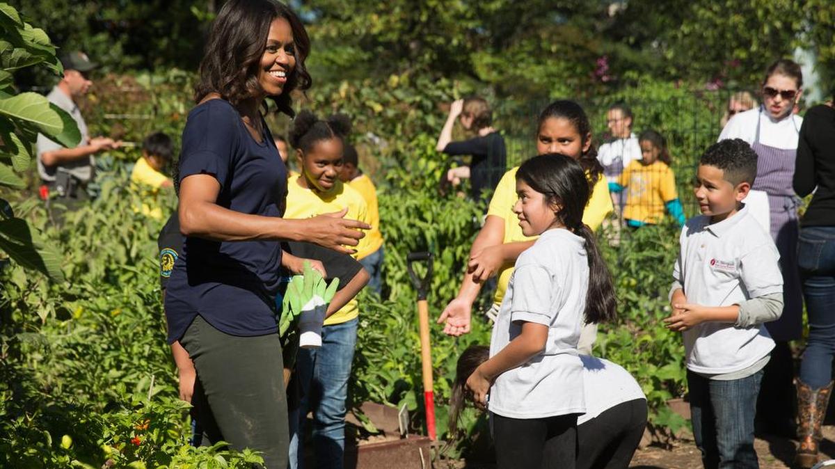 First lady Michelle Obama and Washington-area schoolchildren harvest produce from the White House Kitchen Garden. President-elect Donald Trump’s food policy team is led by lobbyists for fast food and Big Soda and critics of tougher nutritional standards in the school lunch program.