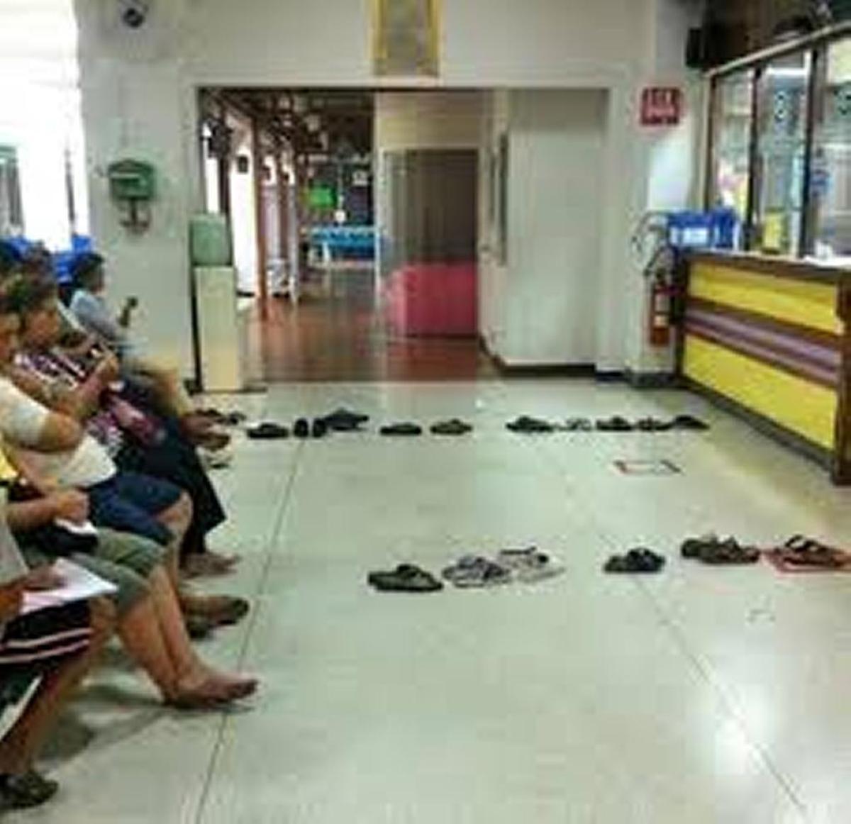 In Thailand, shoes stand in line while people sit down.