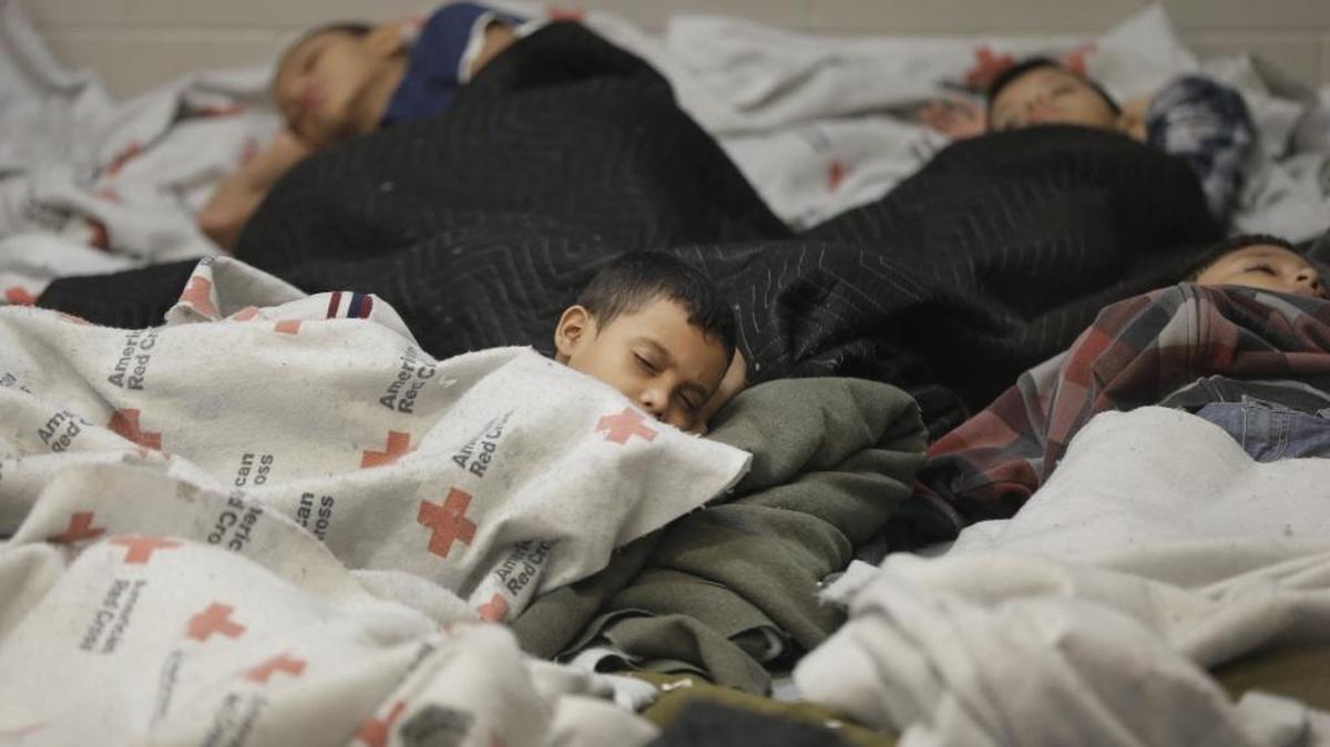 
Detainees sleep in a holding cell in 2014 at a U.S. Customs and Border Protection processing facility in Brownsville,Texas. 
