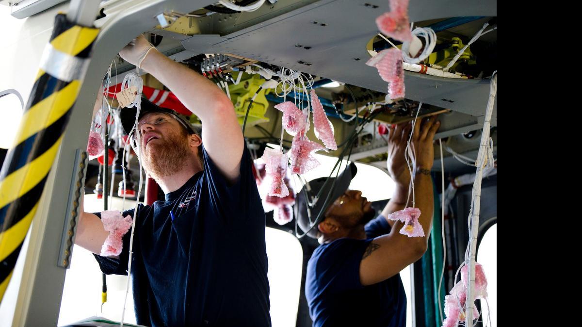 
Workers assemble a helicopter at AgustaWestland’s aircraft manufacturing facility June 22 in Philadelphia. It is among the U.S. companies helped by the Export-Import Bank. The bank is targeted for closure by conservative Republicans.

